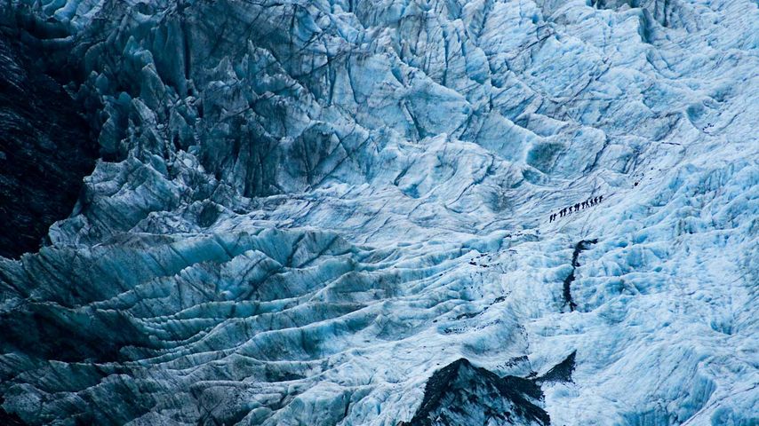 Wanderer auf dem Franz-Josef-Gletscher, Neuseeland